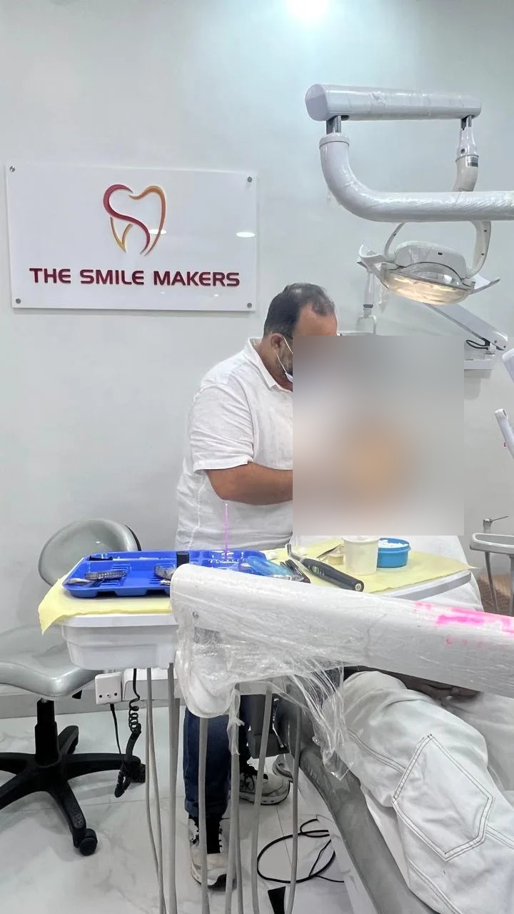 Dr. Mohit Bodhwani (Endodontist) treating a patient at The Smile Makers Dental Clinic