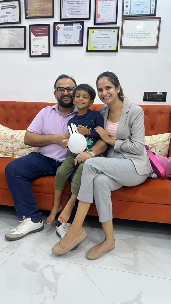 Family on the waiting room sofa at The Smile Makers Dental Clinic, Khar West