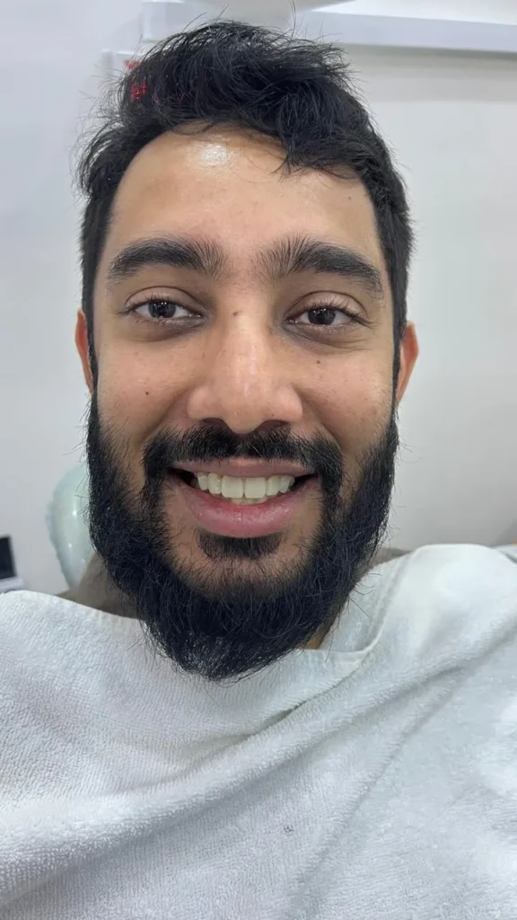 Smiling patient after a smile makeover at The Smile Makers Dental Clinic